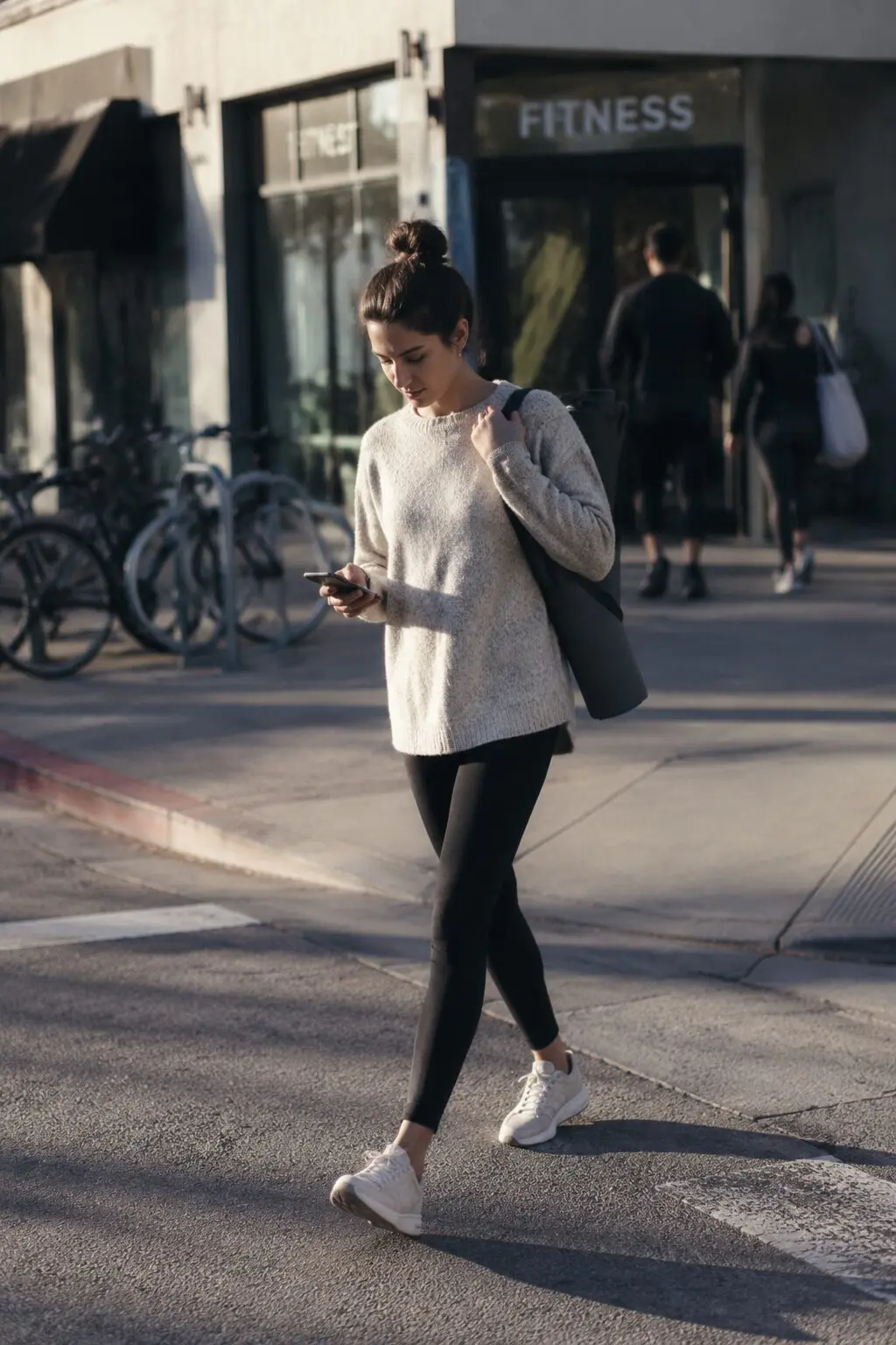 elegant outfits for running late: black ponte legging with long oatmeal tunic sweater for errand day