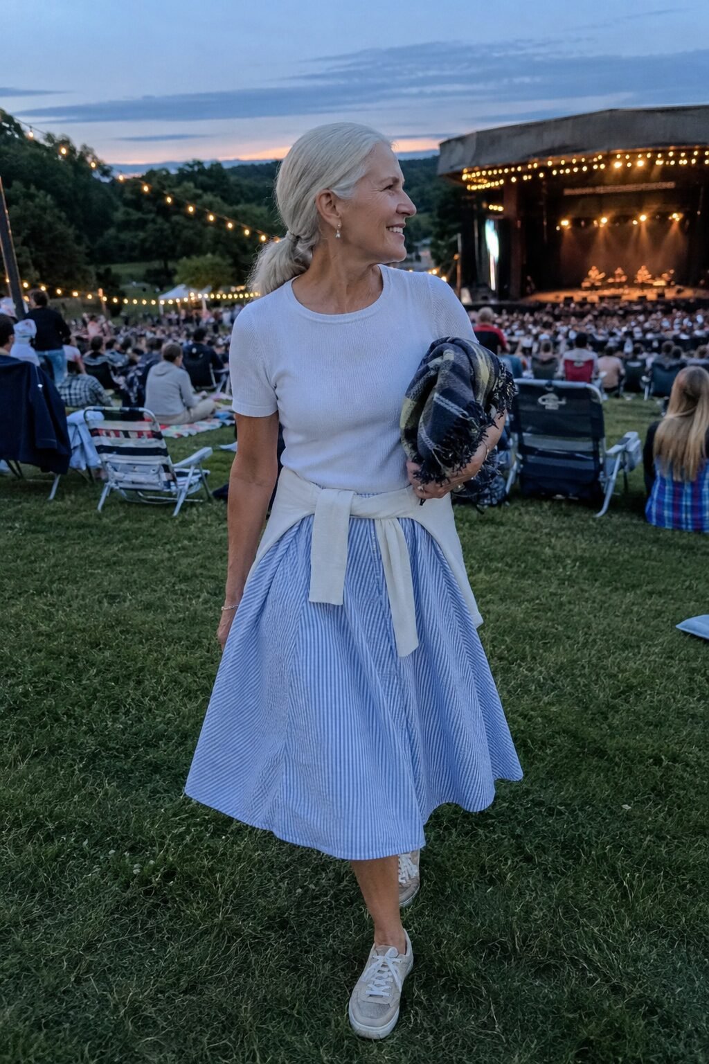 blue-and-white seersucker A-line skirt with white knit tee, cool summer concert outfit for women in their 70s