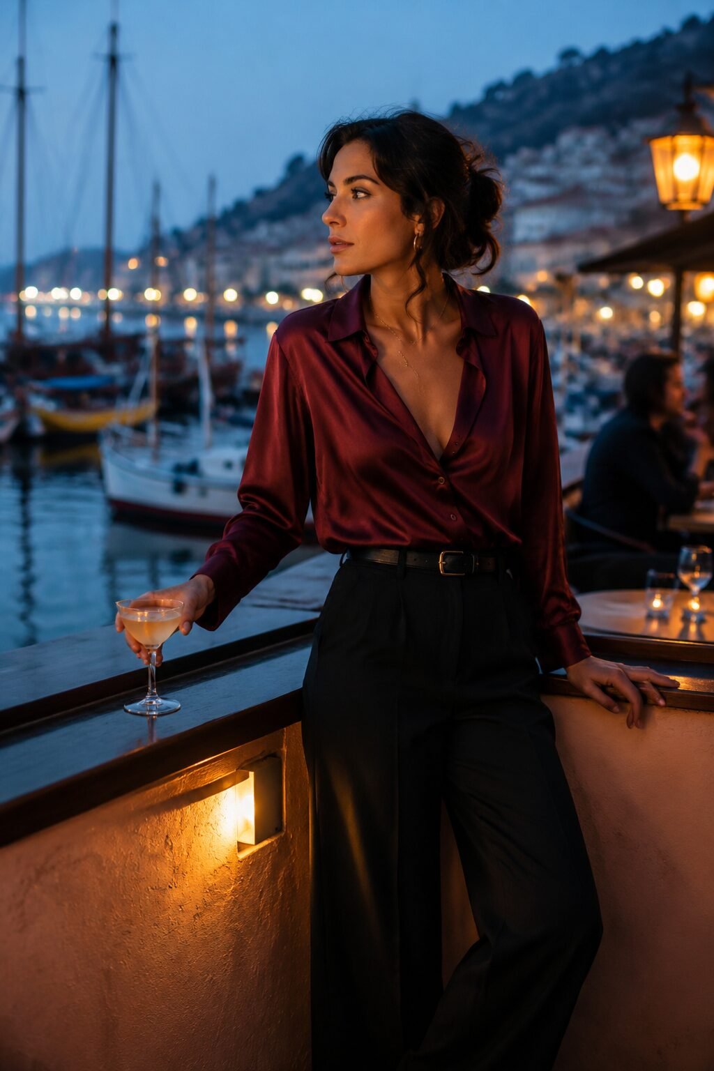 burgundy silk blouse outfit for evening drinks, silk top tucked into black wide-leg trousers