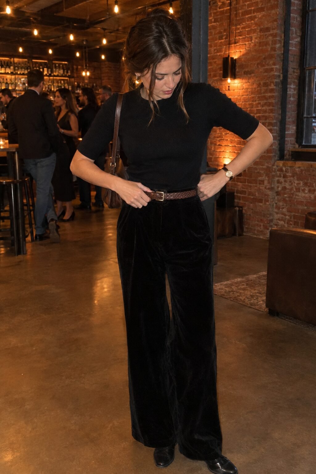 industrial loft wedding guest outfit: black velvet wide-leg pants with a braided leather belt