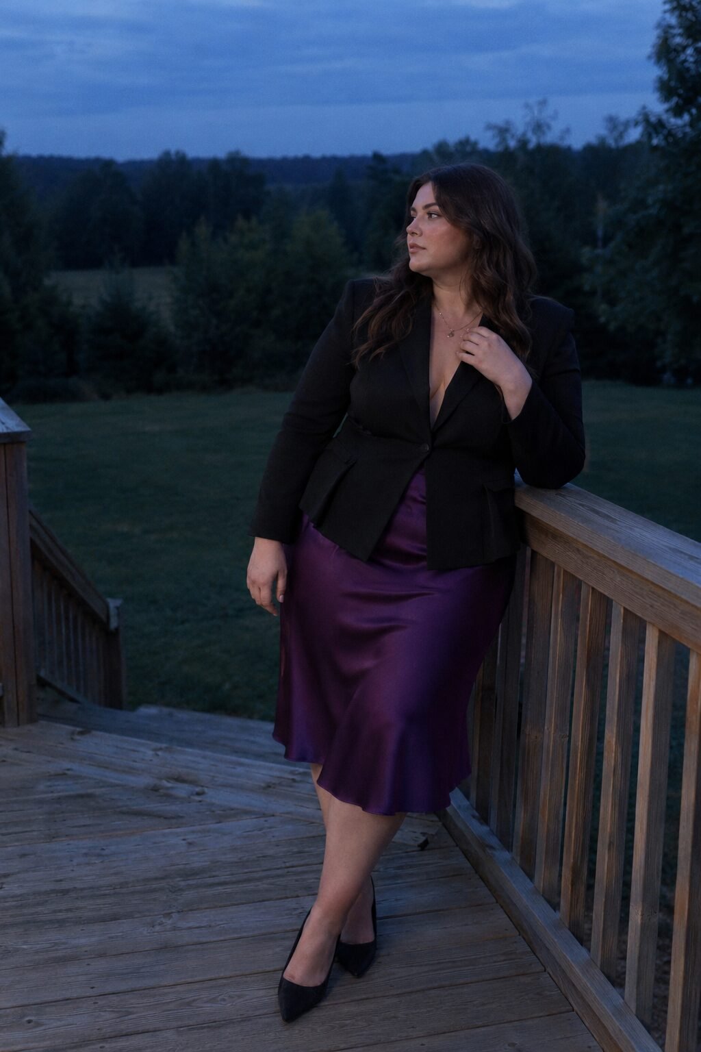 elevated plus size halloween party outfit: black peplum blazer over a deep orchid silk skirt