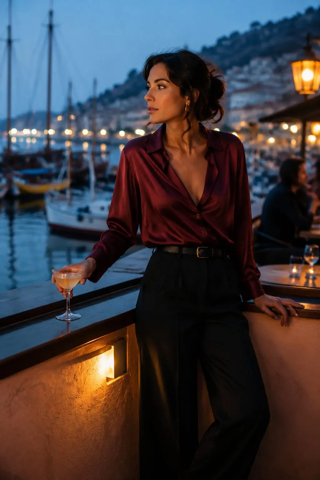 burgundy silk blouse outfit for evening drinks, silk top tucked into black wide-leg trousers
