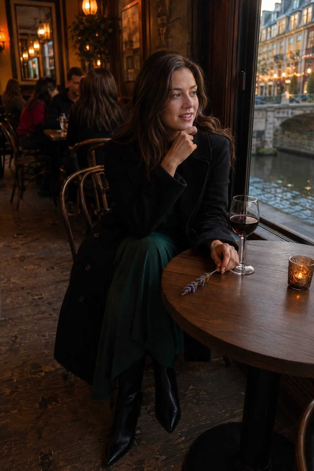 how to style a black trench coat with a midi dress: open black trench over a deep emerald midi dress for a fall dinner date