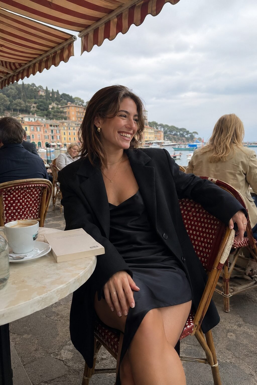 casual all black halloween outfit: satin slip dress layered under an oversized blazer