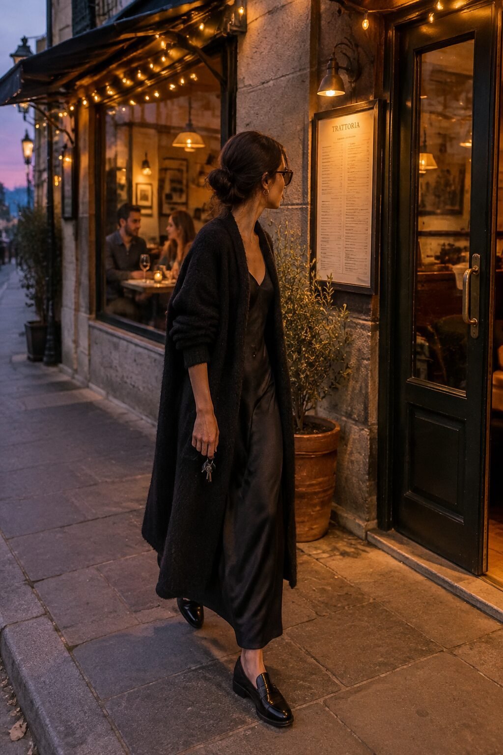 casual dinner date outfit: black cashmere wrap cardigan over a black silk slip dress with black penny loafers