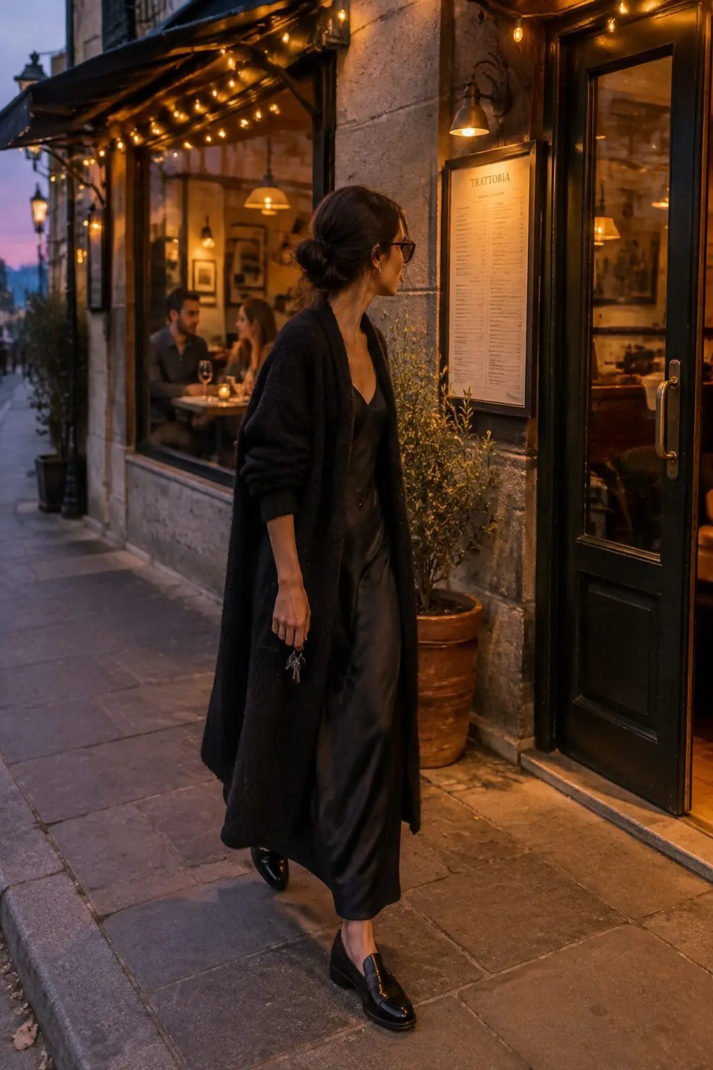 casual dinner date outfit: black cashmere wrap cardigan over a black silk slip dress with black penny loafers
