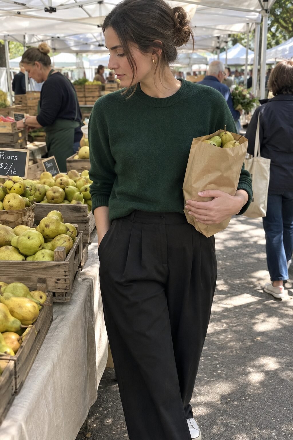 old money outfit: forest green cashmere crewneck sweater with black high-waist pleated trousers