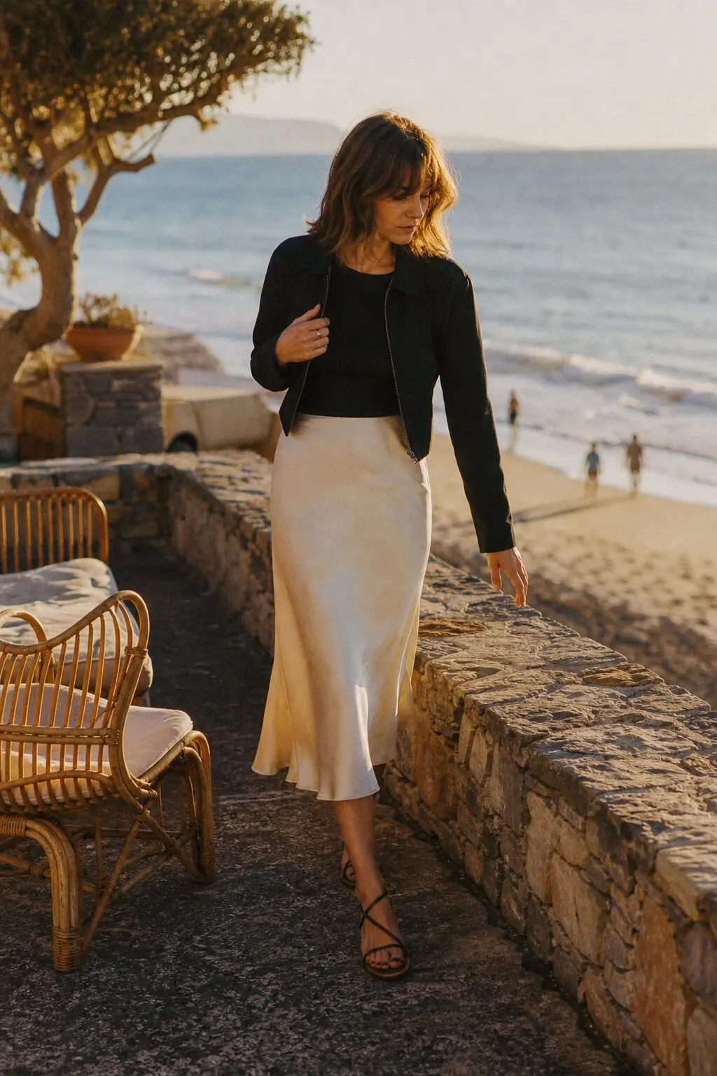 casual halloween party outfit: ivory satin skirt with a black tee and cropped jacket
