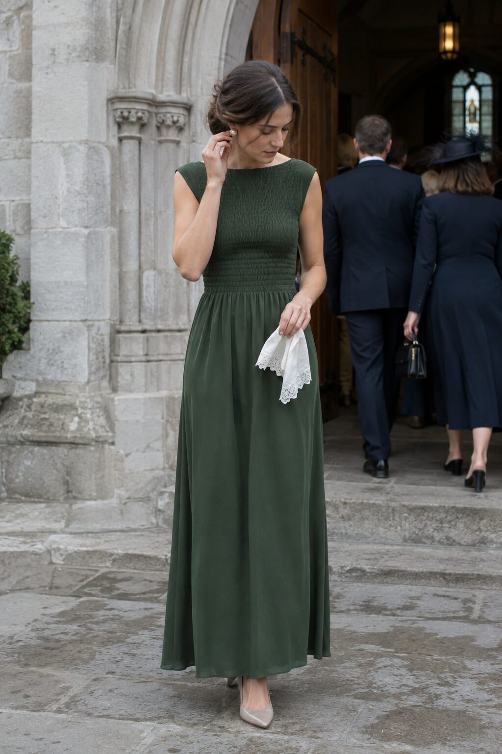 formal church wedding guest outfit: cedar green smocked maxi dress with pearl stud earrings