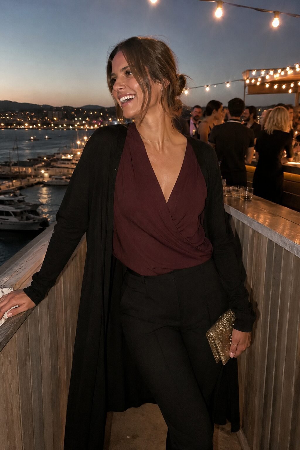 networking cocktail hour outfit: burgundy jersey wrap top, black ponte trousers, and a long merino duster cardigan