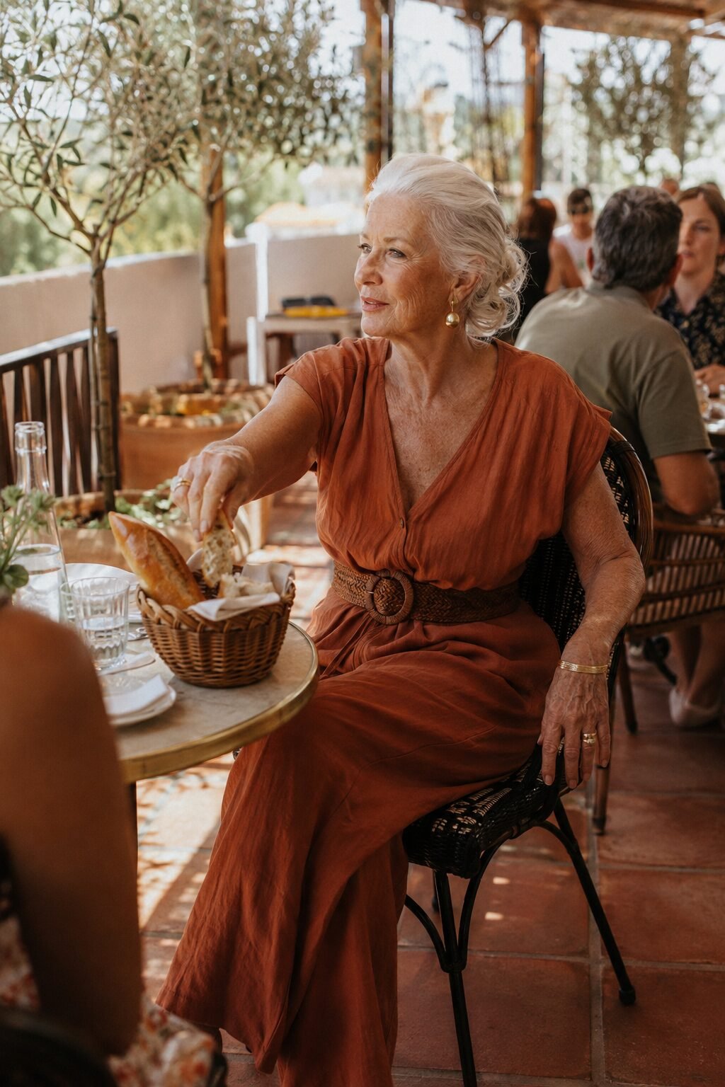 terracotta linen wide-leg jumpsuit with woven belt, warm-weather brunch outfit for women in their 70s