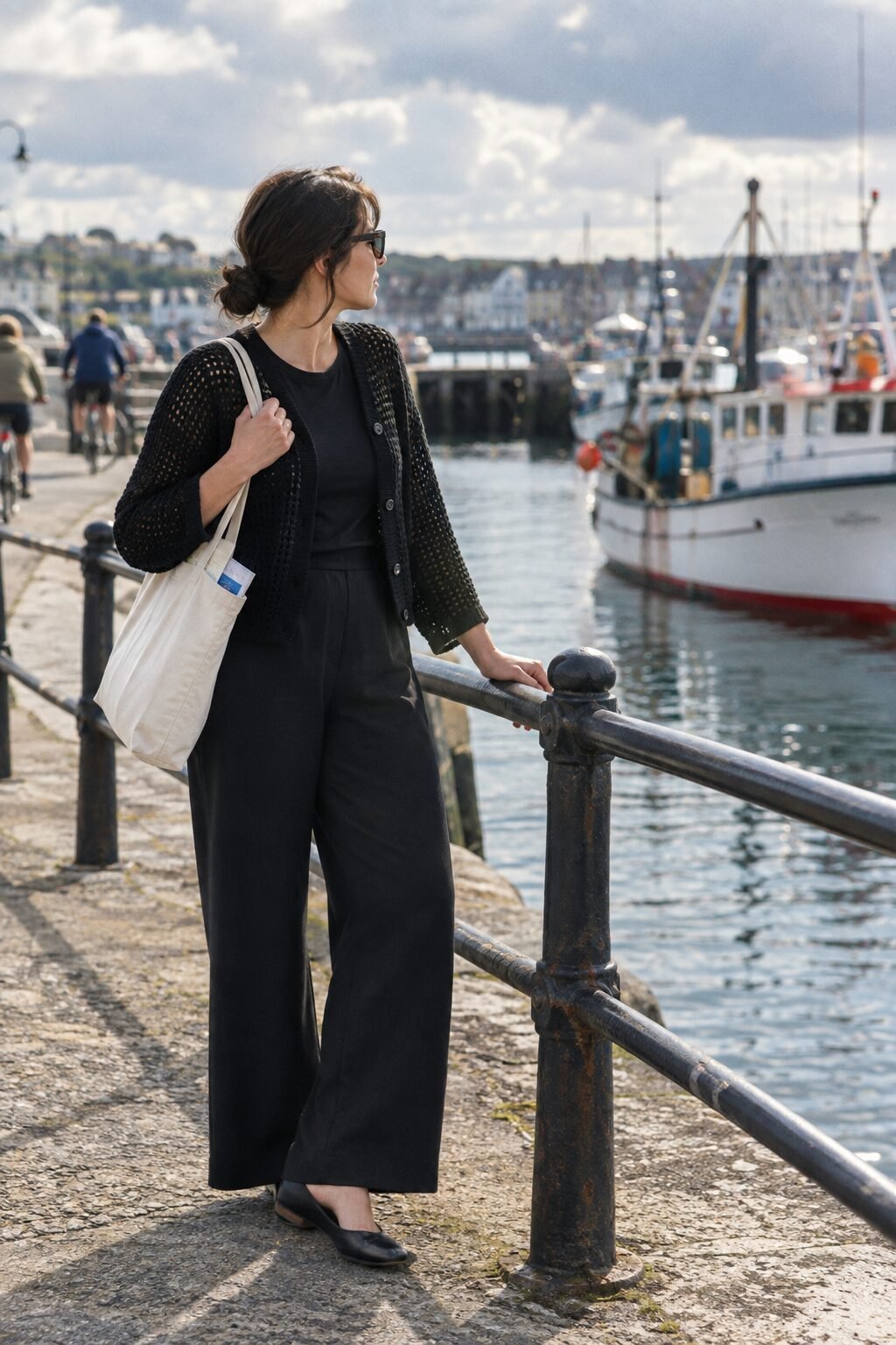 black cotton crochet cardigan over black high-rise wide-leg ponte pull-on pants, changeable-weather sightseeing outfit