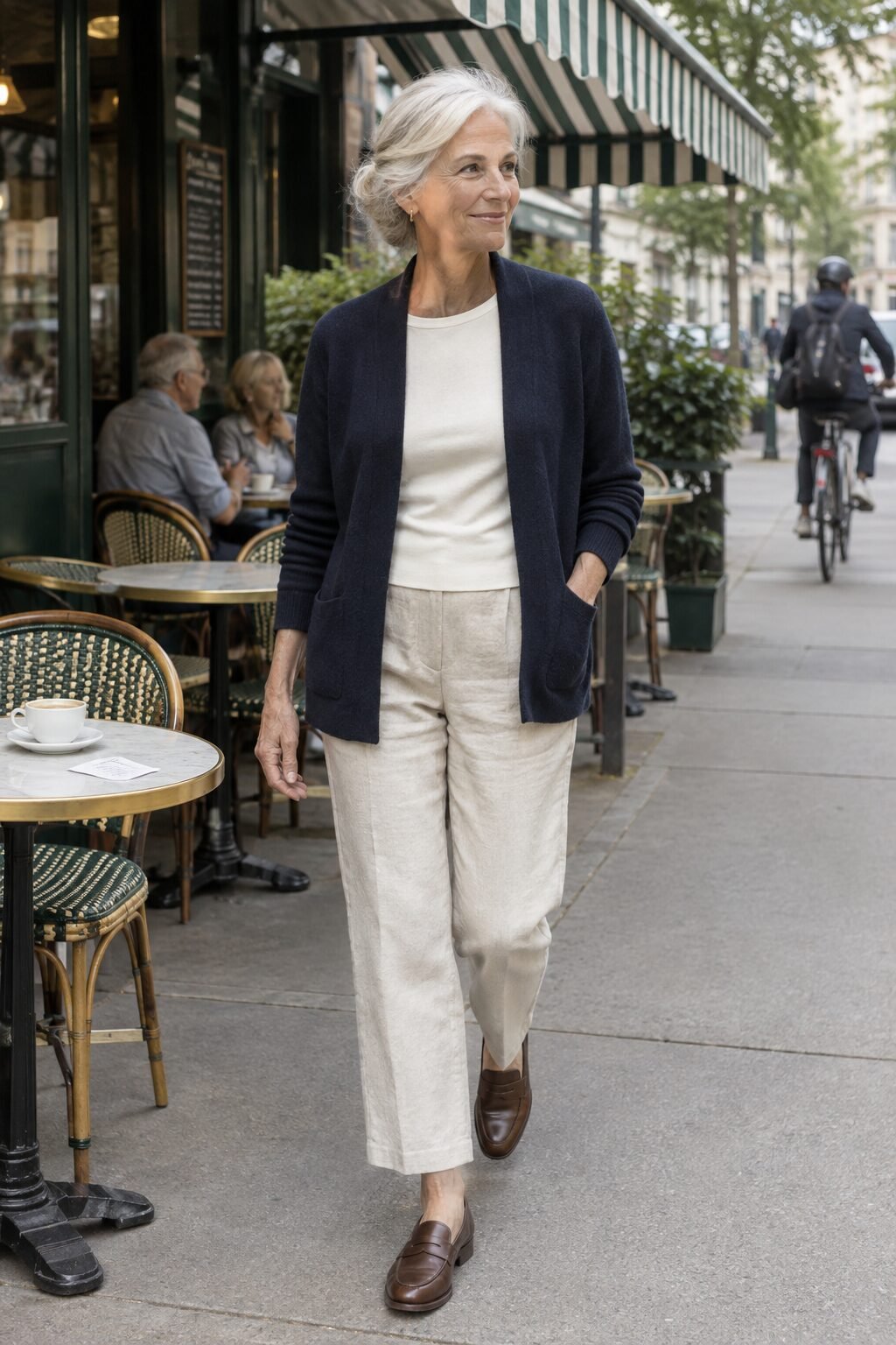 elegant spring outfit for women in their 70s: navy merino cardigan with linen-blend pants and cocoa penny loafers