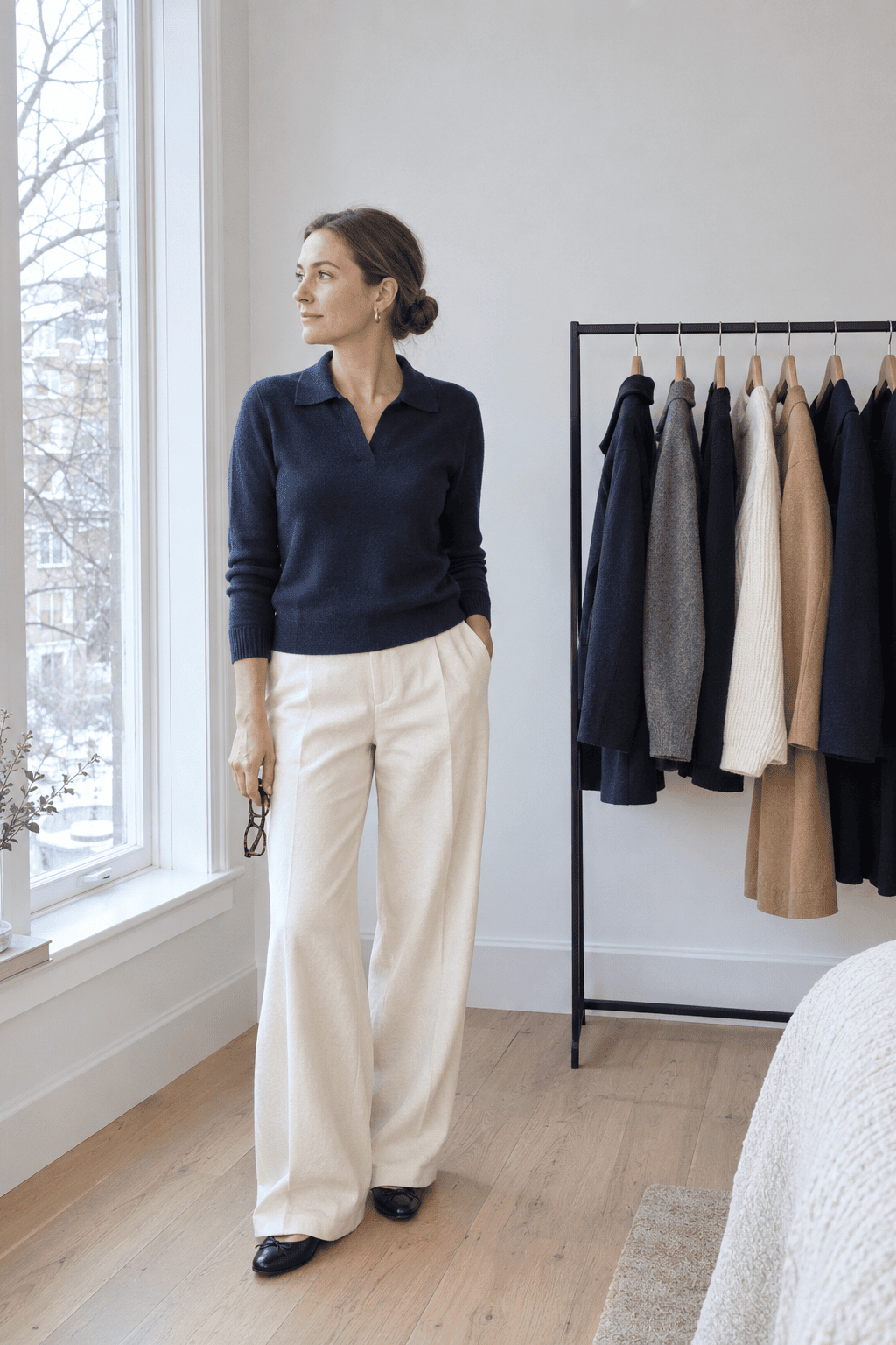 small edited clothes rail of classic neutral pieces, a capsule wardrobe with no trend items