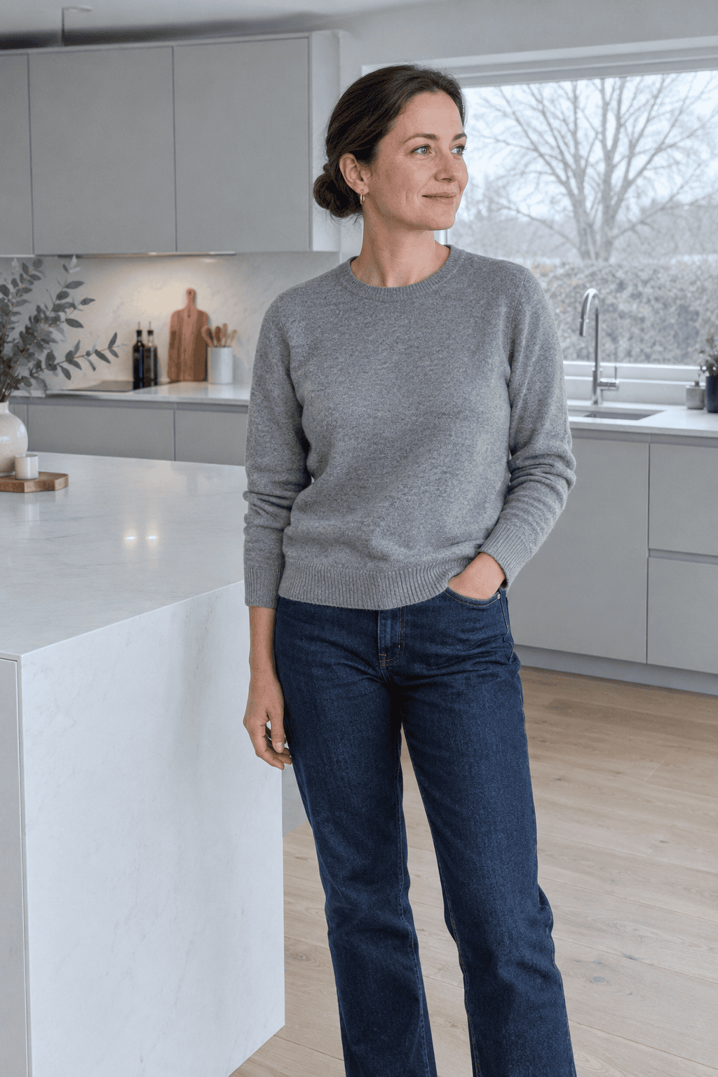 woman wearing a plain cashmere crewneck sweater at home, a capsule wardrobe knit that lasts
