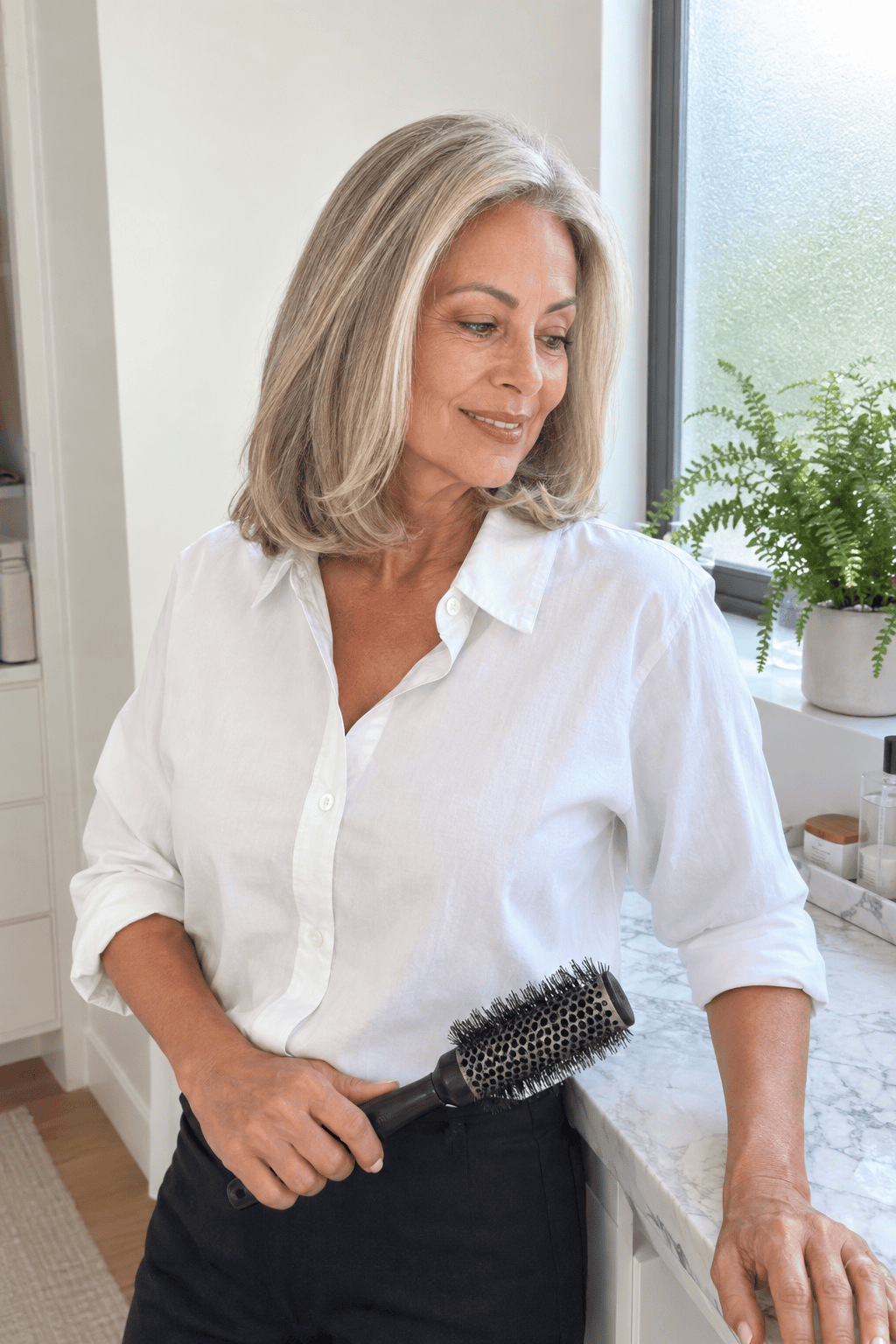 hairstyles for women over 60: shoulder-skimming lob with a smooth round-brush blowout and soft bent ends