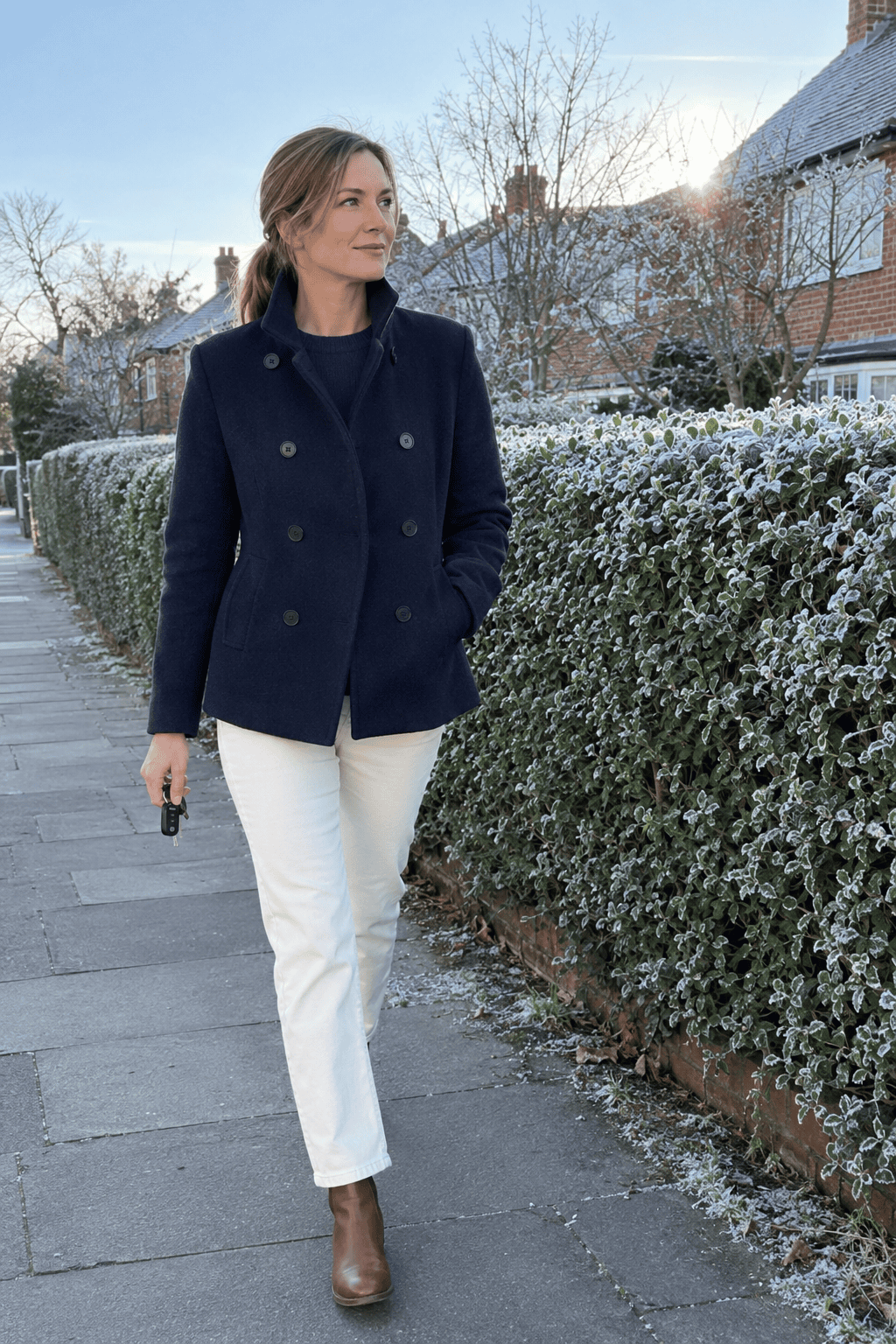 simple winter school run outfit that looks expensive: navy wool-blend peacoat, navy merino sweater and ecru straight jeans