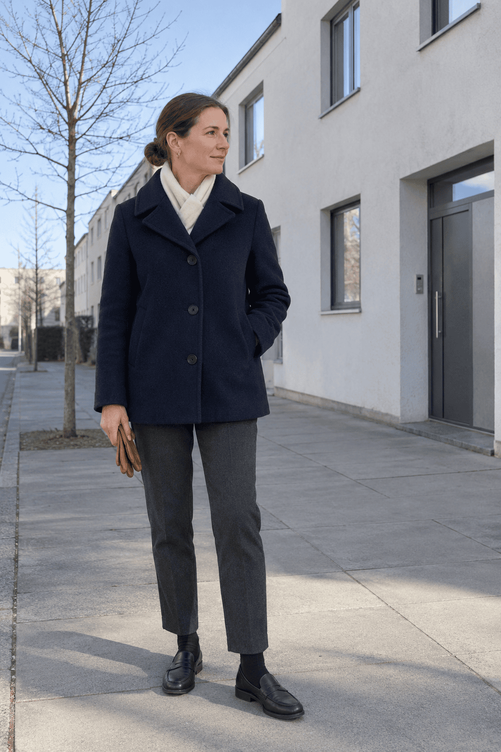 woman wearing plain black leather shoes she can walk in all day, a capsule wardrobe staple