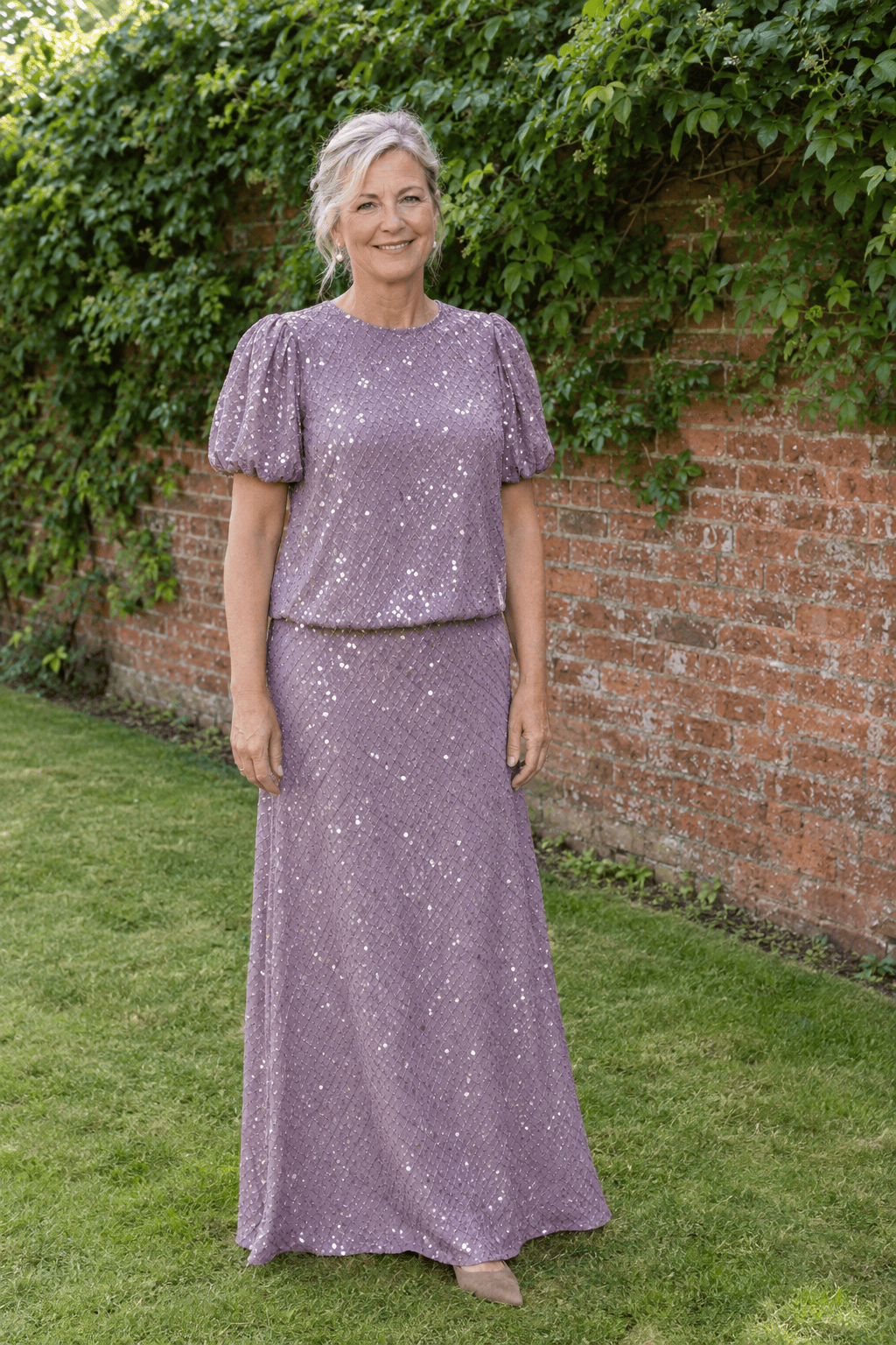 mother of the bride outfit in mauve: sequin flutter-sleeve top with a matching floor-length A-line skirt and taupe suede kitten-heel slingbacks