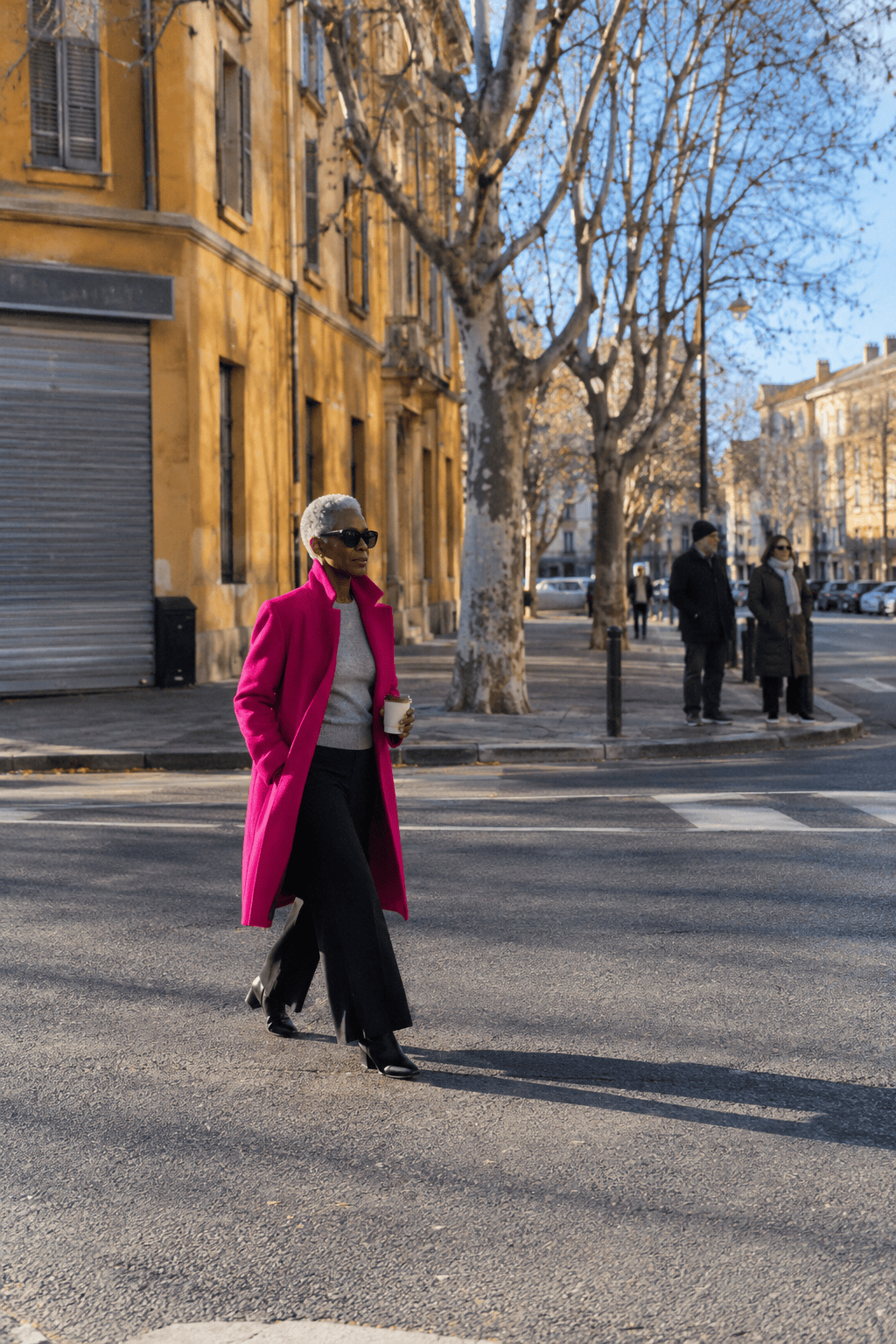 warm winter outfits for women over 60: bold fuchsia funnel neck wool coat, heather grey cashmere crewneck and black wide-leg pull-on ponte trousers