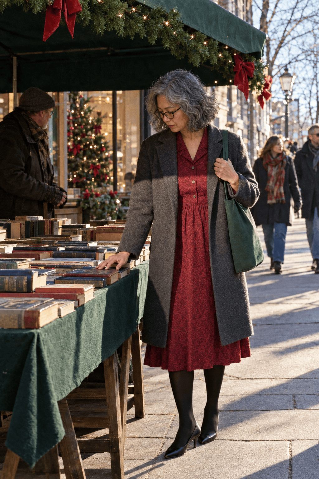 December mother of the groom wedding outfit: short-sleeve cranberry jacquard midi dress with a full skirt under a charcoal wool coat with black kitten-heel pumps