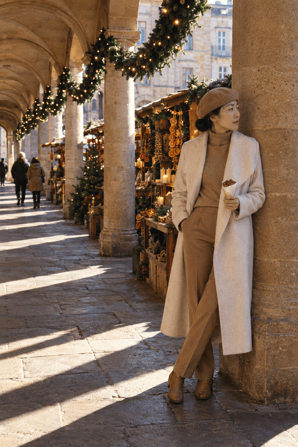tonal christmas market outfit with a long cream draped-collar wool wrap coat, camel turtleneck and camel wool trousers