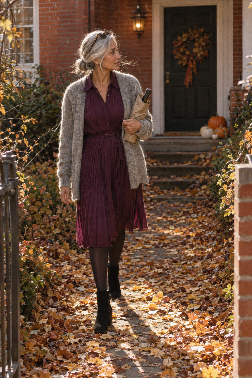 elegant thanksgiving outfit for women over 60: plum chiffon pleated shirtdress, grey alpaca cardigan and suede booties