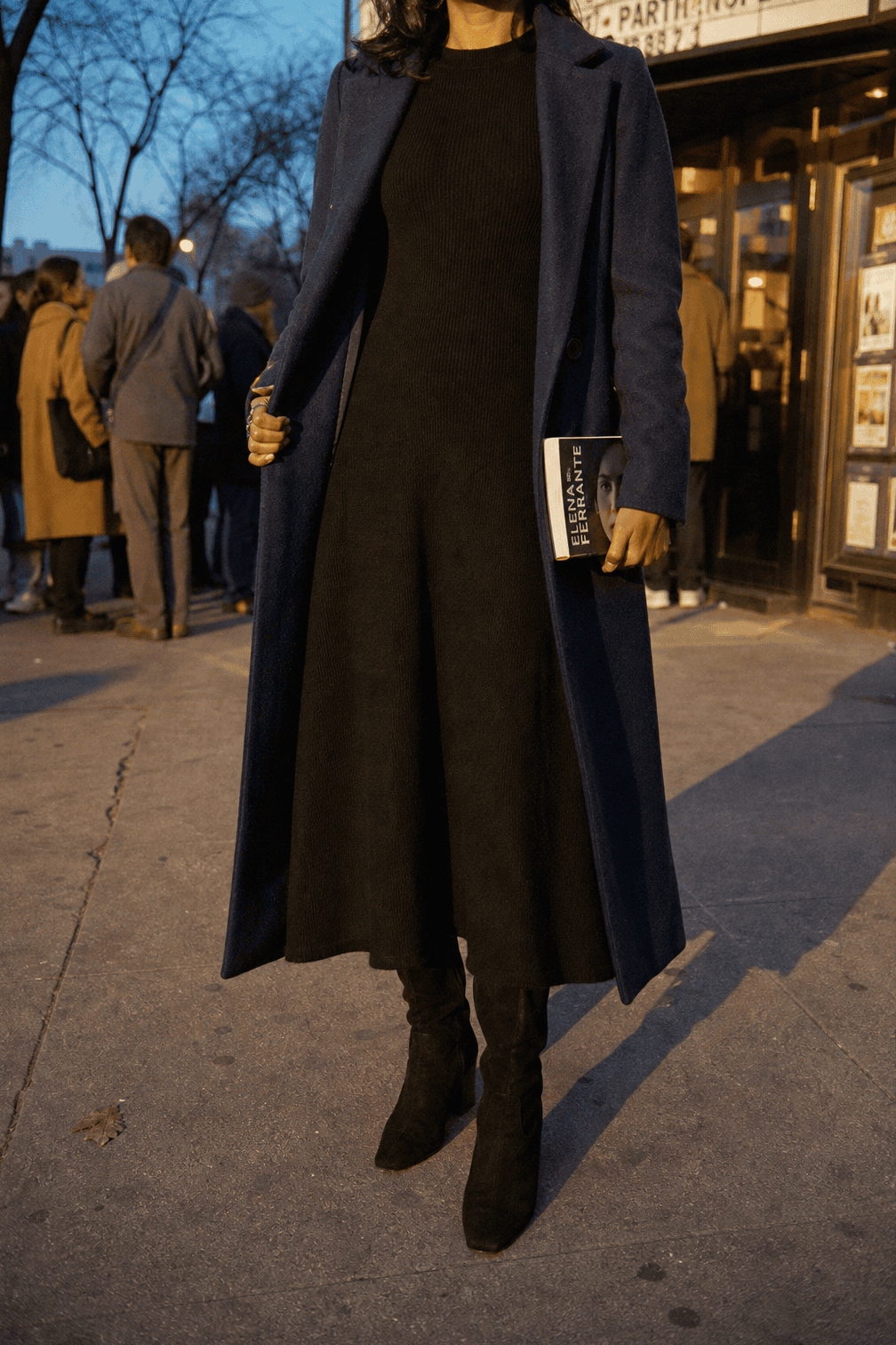 winter date night outfit: black long-sleeve knit maxi dress with black suede knee-high boots and a navy wool-blend coat