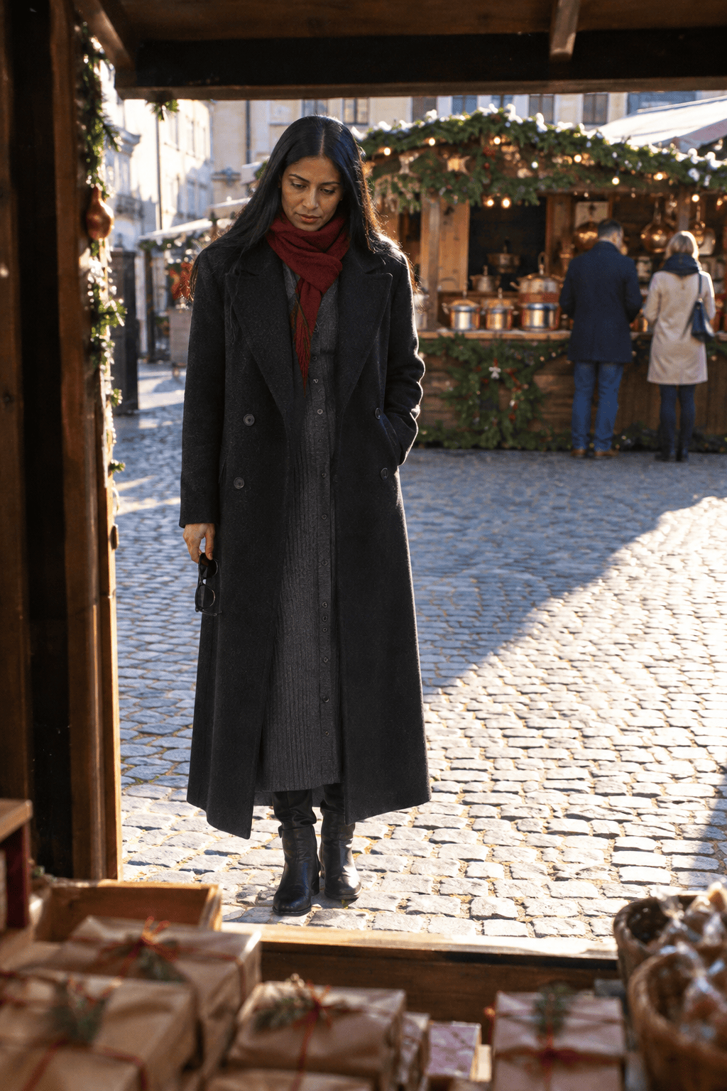 christmas market date outfit with a very long black double-breasted wool coat, charcoal ribbed sweater dress to the ankle and black riding boots