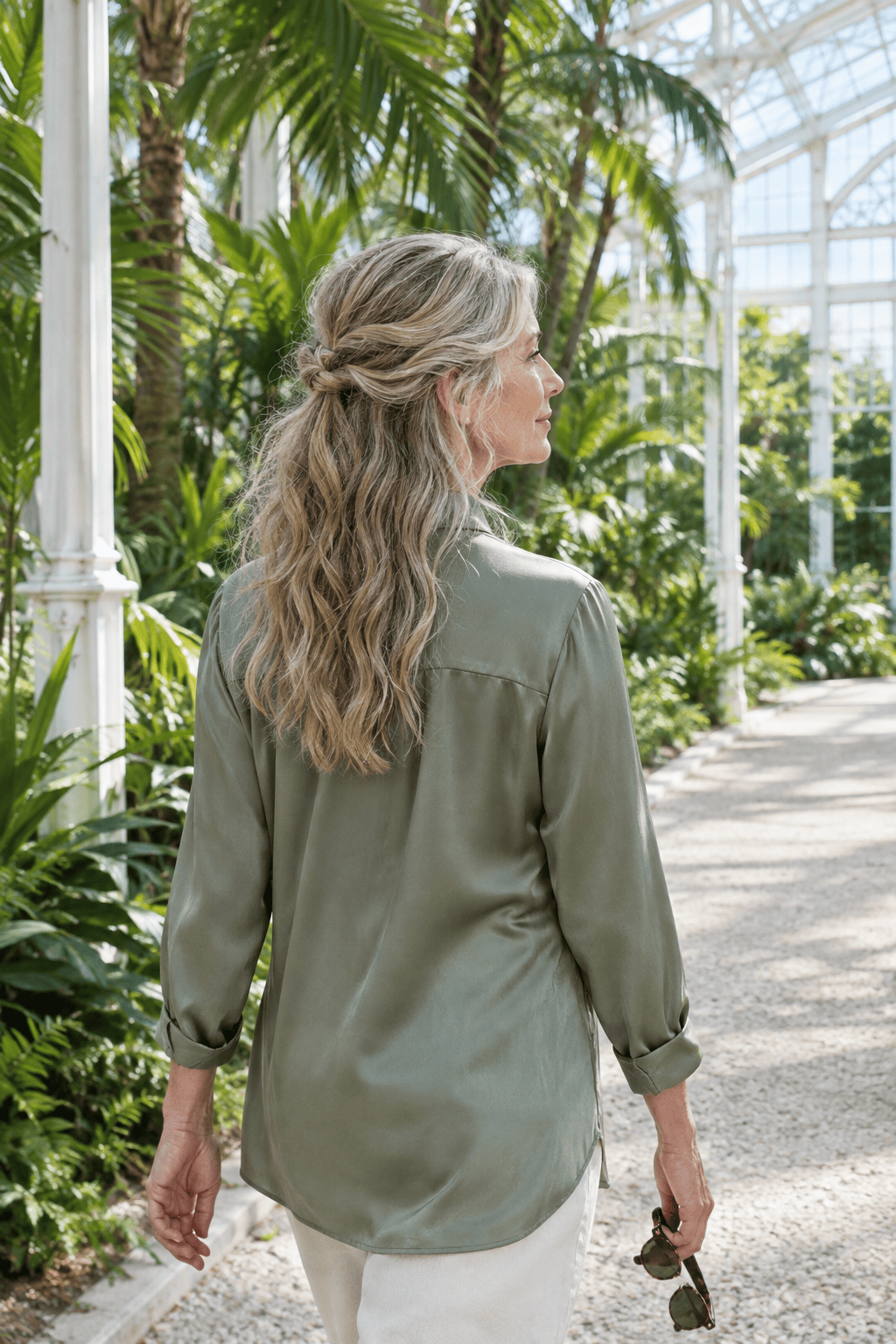 long hair over 60: half-up twist pinned at the crown with the rest worn down