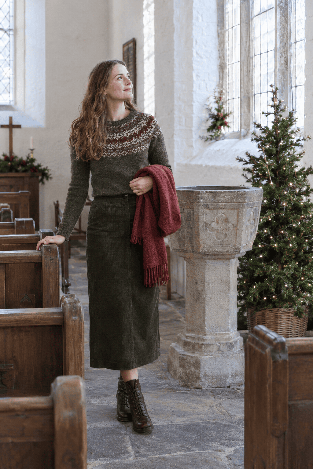 christmas church outfit: olive Fair Isle crewneck sweater with a merlot and cream yoke and a dark olive corduroy midi skirt