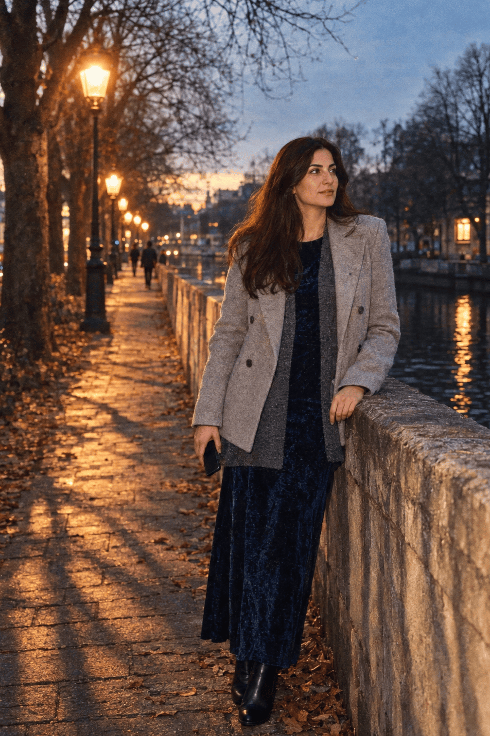 winter date night outfit: navy burnout velvet maxi dress with a grey alpaca-blend cardigan, black leather ankle boots and a light grey wool coat