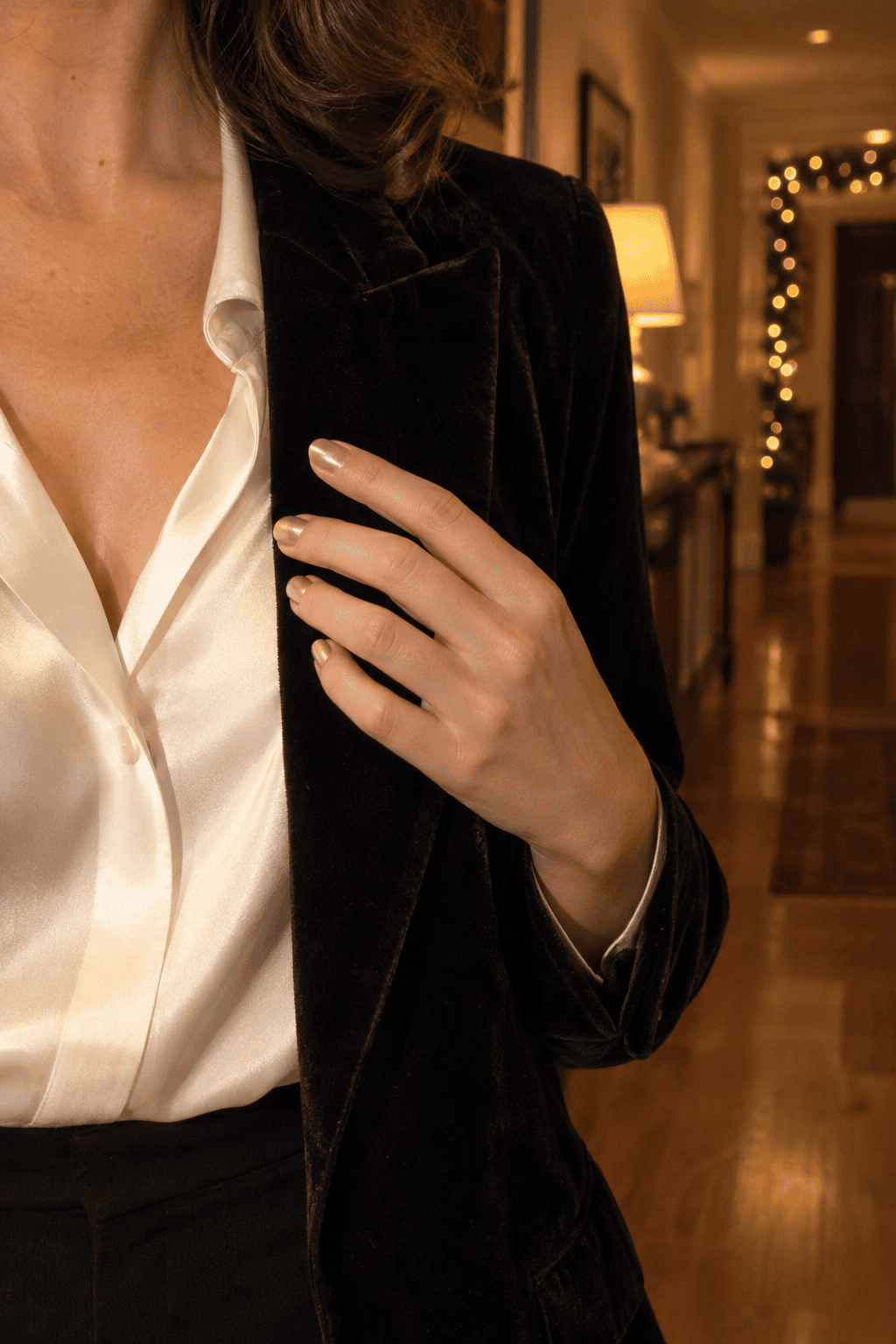 classy christmas nails in fine champagne shimmer polish against a black velvet blazer and ivory silk blouse